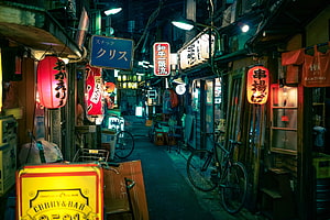 Illuminated Japanese Alleyway at Night with Traditional Lanterns and Neon Signs HD wallpaper