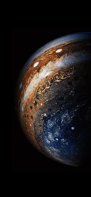 Jupiter Planet Close-Up with Swirling Cloud Bands and Storm Systems in Deep Space HD phone wallpaper