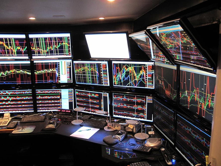 Professional Stock Trading Desk with Multiple Financial Chart Monitors and Market Data Displays HD wallpaper