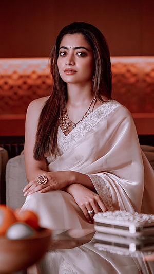 Rashmika Mandanna in an elegant ivory silk saree with intricate floral embroidery and traditional jewelry HD phone wallpaper