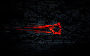 Red Ubuntu Logo with Motion Streaks on Dark Textured Background HD wallpaper