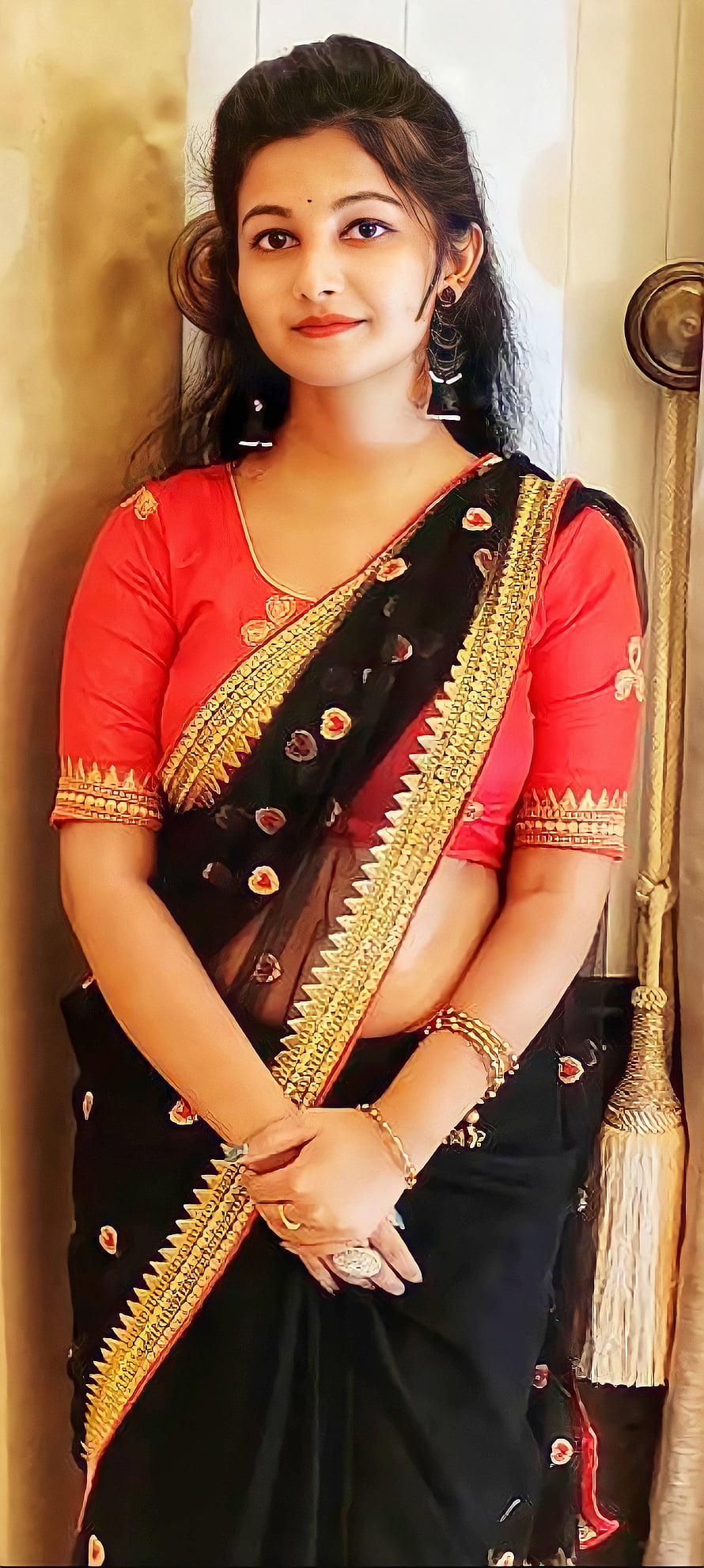 Elegant Indian Woman in Black and Red Saree with Gold Zari Border HD phone wallpaper
