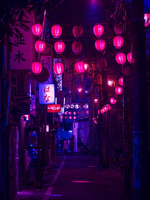 Neon-lit Tokyo alleyway at night with glowing pink lanterns and cyberpunk atmosphere HD phone wallpaper