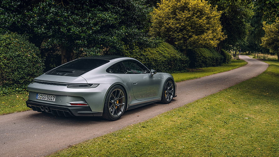Silver Porsche 911 GT3 Touring parked on a tree-lined country road HD wallpaper