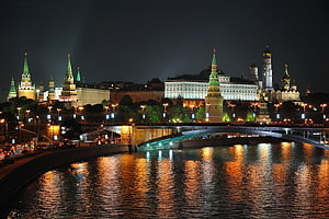 Moscow Kremlin and Red Square at Night with River Reflections and Bridge HD wallpaper