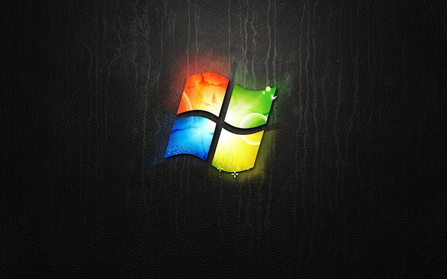 Windows XP Logo on Dark Textured Background with Colorful Glow Effect HD wallpaper