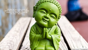 Smiling Green Tiny Buddha Figurine with Hands in Prayer on Weathered Wood HD wallpaper