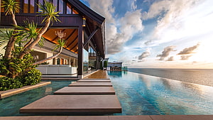 Tropical Luxury Villa With Infinity Pool Overlooking The Ocean At Sunset HD wallpaper