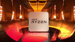 AMD Ryzen Processor on a Glowing Circuit Board with Warm Orange and Red Lighting HD wallpaper