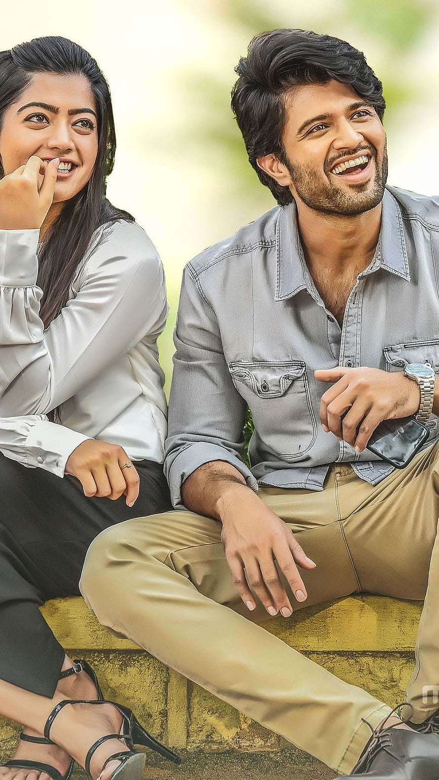 Vijay Deverakonda and Rashmika Mandanna smiling outdoors in casual attire HD phone wallpaper