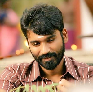 Dhanush Portrait in Striped Shirt with Warm Background HD wallpaper