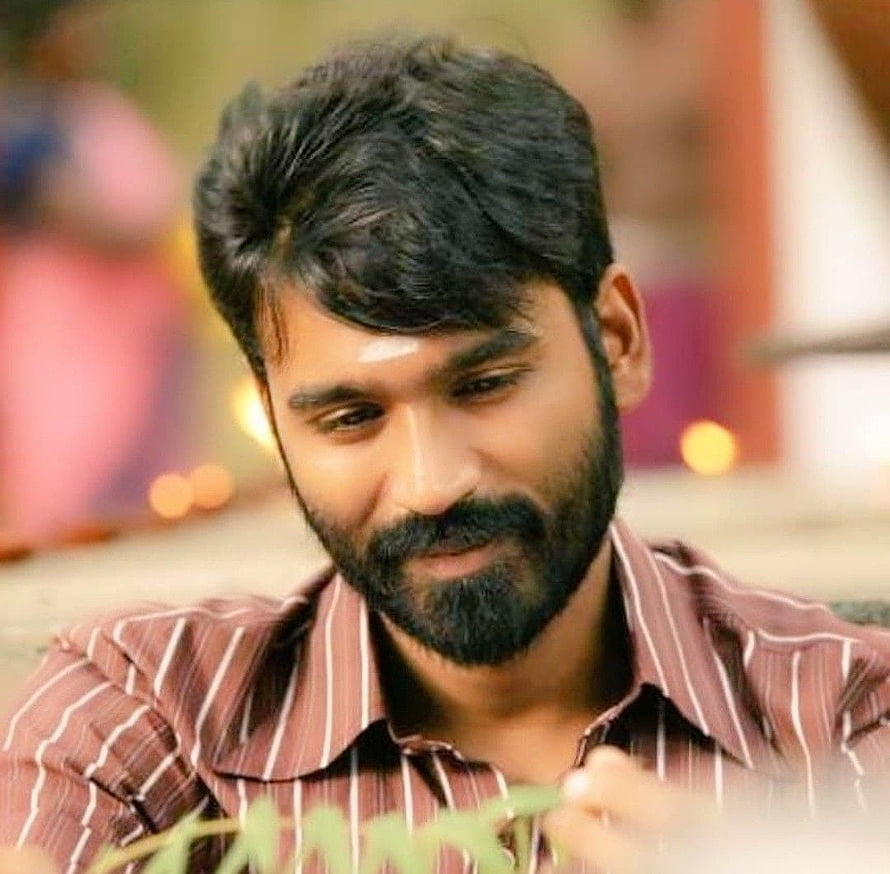 Dhanush Portrait in Striped Shirt with Warm Background HD wallpaper