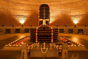 Dhyanalinga at Bhuvaneshwara Temple with Flower Offerings and Oil Lamps HD wallpaper