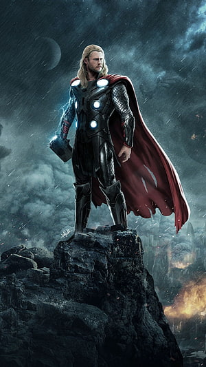 Thor Standing on Rocky Cliff in Dark Stormy Sky with Lightning and Red Cape HD phone wallpaper