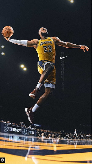 LeBron James in Lakers Jersey Executing a Powerful Mid-Air Dunk on the Court HD phone wallpaper