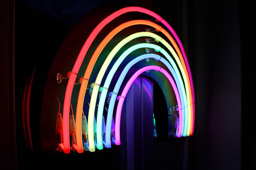 Vibrant Rainbow Neon Arch Installation Against Dark Background HD wallpaper