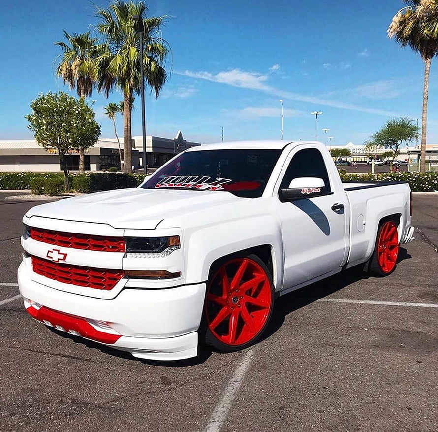 White Chevrolet Silverado Lowrider with Red Wheels and Custom Grille HD wallpaper