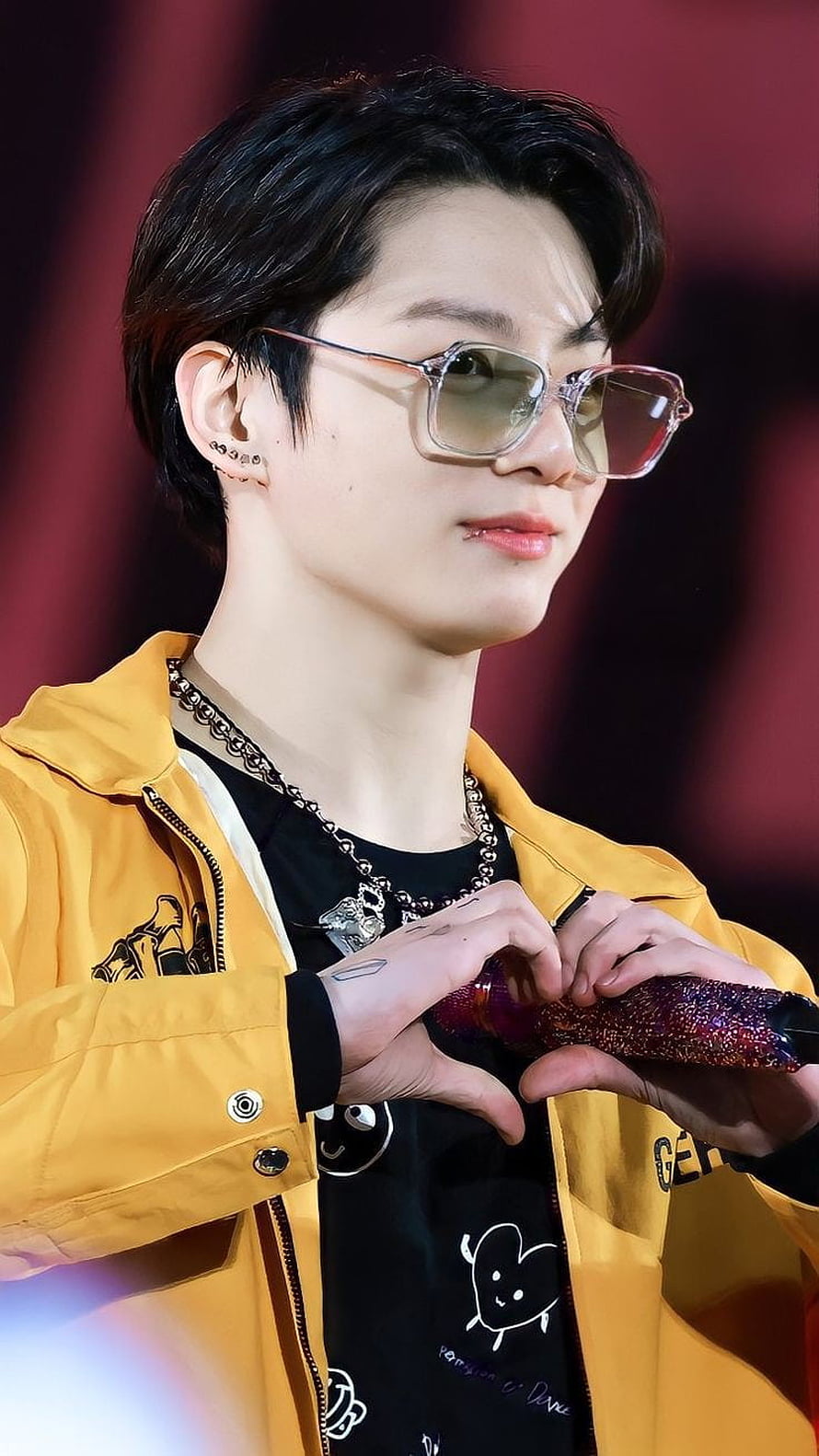 Jungkook from BTS performing on stage in a yellow jacket and sunglasses HD phone wallpaper