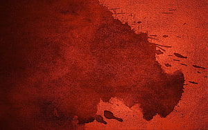 Deep Crimson Paint Stain on Rough Textured Surface HD wallpaper