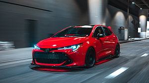 Red Toyota Corolla Gr Sport Hatchback Driving Through Urban Tunnel At Night HD wallpaper