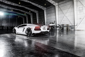 White Lamborghini Aventador LP700-4 Parked Inside a Hangar with a Small Aircraft HD wallpaper