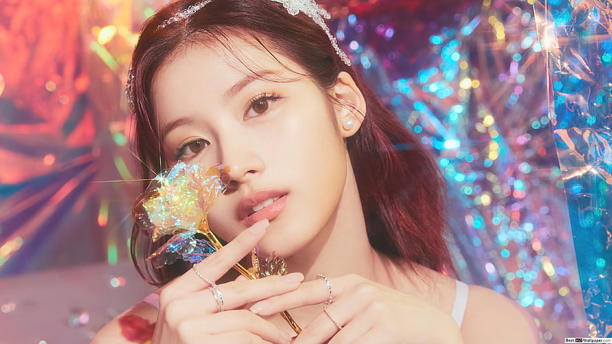 Sana from TWICE in a dreamy portrait holding a holographic flower against a glittering bokeh backdrop HD wallpaper