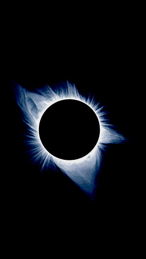 Total Solar Eclipse with Prominent Corona Against Deep Black Sky HD phone wallpaper