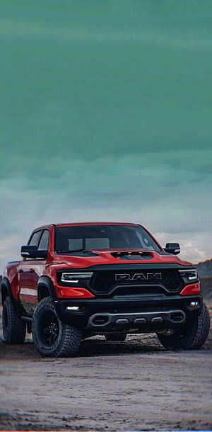 Red Ram TRX Off-Road Pickup Truck on Gravel Terrain Under Dramatic Sky HD phone wallpaper
