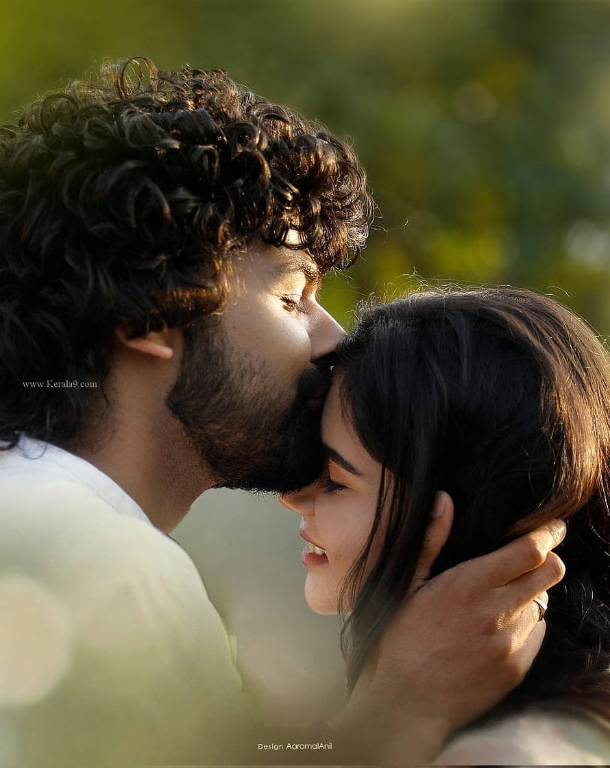 Hridayam Movie Still: Romantic Couple Sharing an Intimate Moment in Golden Hour Light HD phone wallpaper