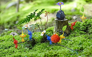 Pikmin 3 Characters Exploring a Mossy Forest with Flowers and Berries HD wallpaper