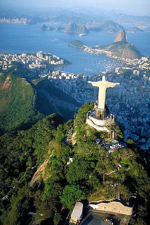 Aerial View of Christ the Redeemer Statue Overlooking Rio de Janeiro and Sugarloaf Mountain HD phone wallpaper