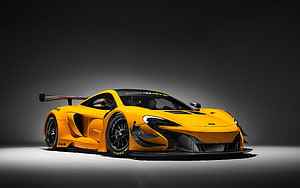 McLaren 650S GT3 Race Car in Vibrant Yellow with Black Accents and Rear Wing HD wallpaper