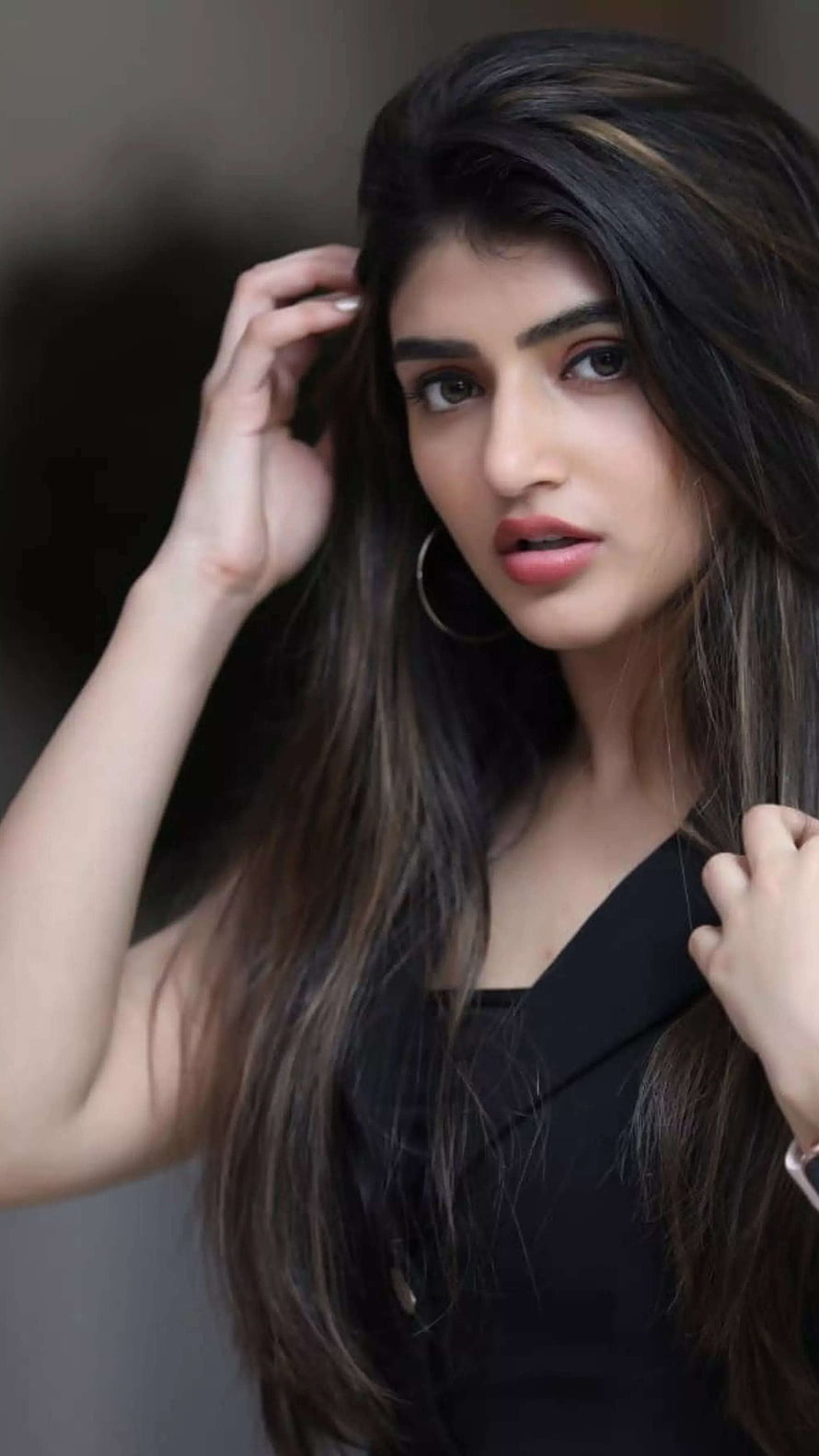 Sreeleela Portrait in Black Blazer with Long Dark Hair and Gold Hoop Earrings HD phone wallpaper
