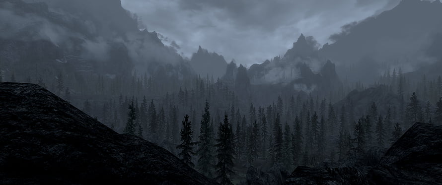 Dark Misty Mountain Valley with Pine Forest and Rocky Outcrops HD wallpaper