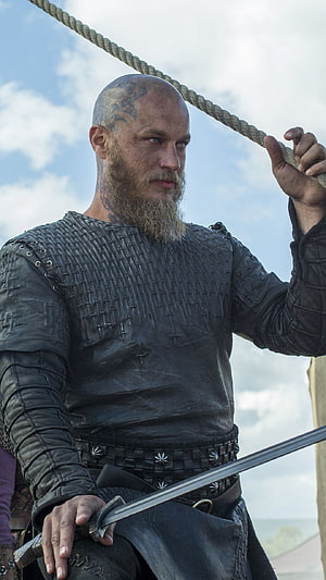 Ragnar Lothbrok in Viking Armor Holding Sword and Rope HD phone wallpaper