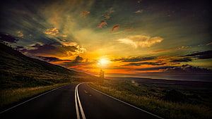 Golden Sunset Over Coastal Highway With Dramatic Clouds And Ocean Horizon HD wallpaper