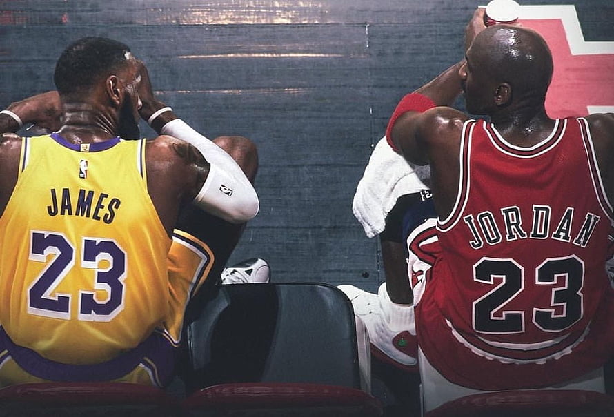 LeBron James and Michael Jordan seated on the bench in Lakers and Bulls jerseys HD wallpaper