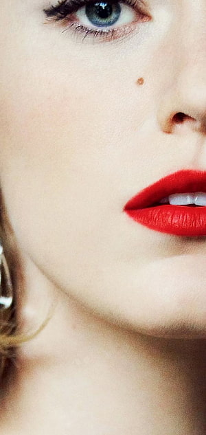 Close-up beauty portrait of a woman with striking blue eyes and bold red lips HD phone wallpaper