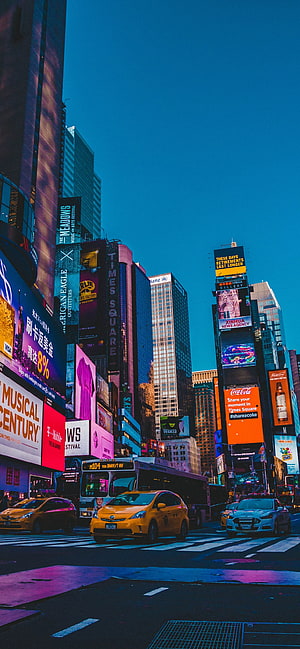 Vibrant Times Square New York City Night Scene with Neon Billboards and Yellow Taxis HD phone wallpaper