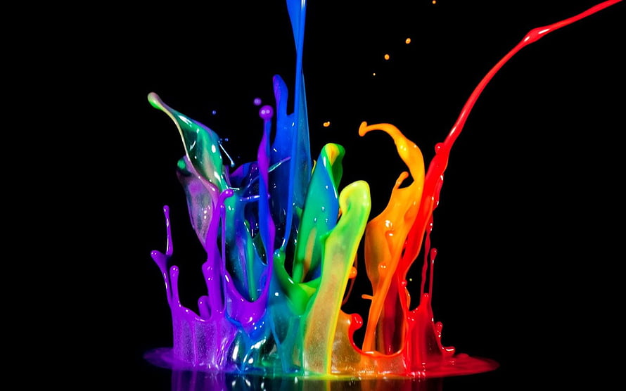 Vibrant Rainbow Paint Splash Frozen in Motion Against a Black Background HD wallpaper