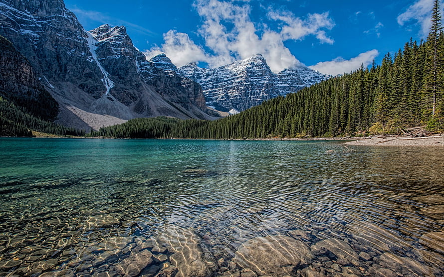 Turquoise Mountain Lake with Snow-Capped Peaks and Dense Evergreen Forest HD wallpaper