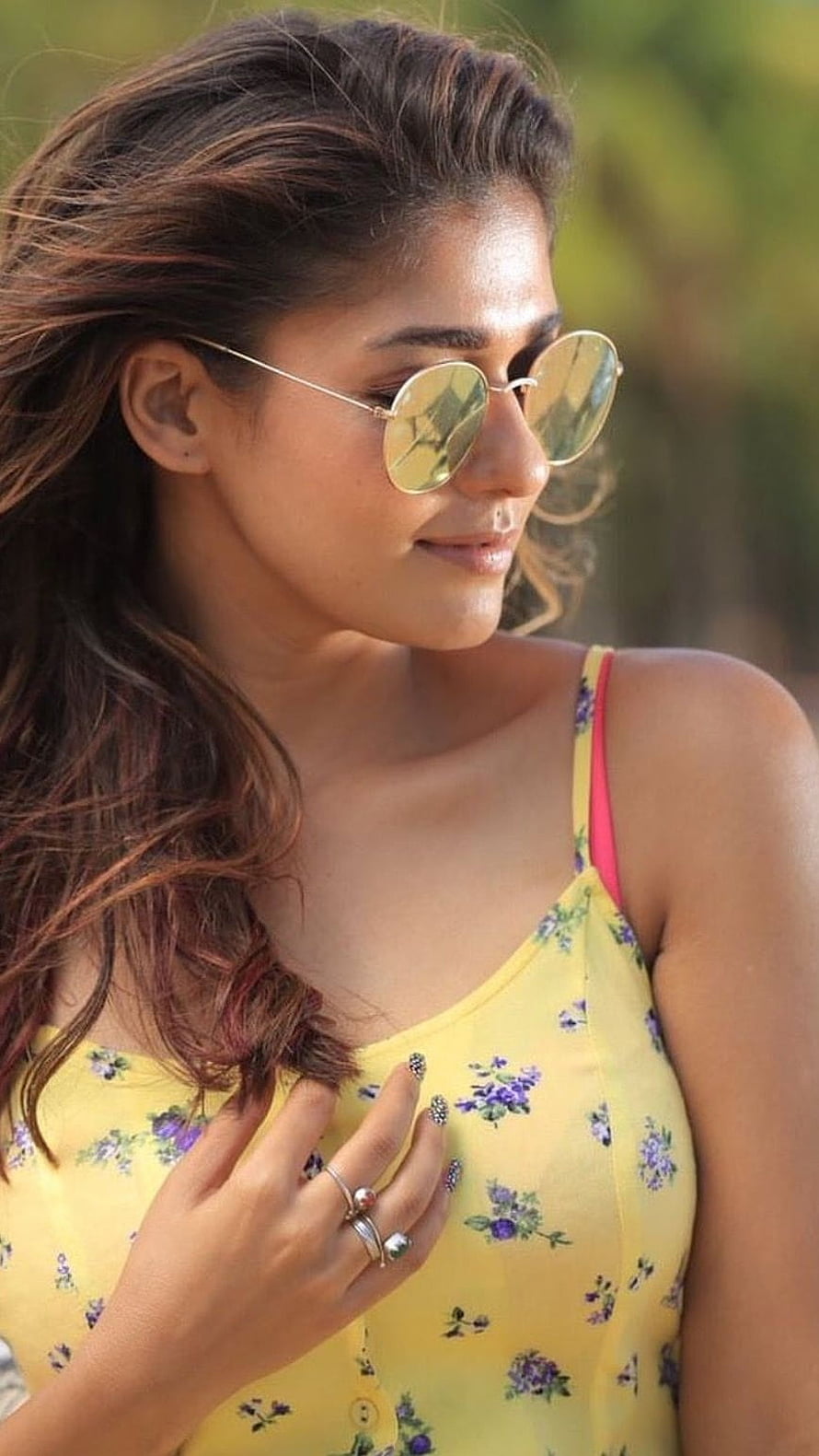 Nayanthara in a yellow floral top with round sunglasses and wavy hair HD phone wallpaper