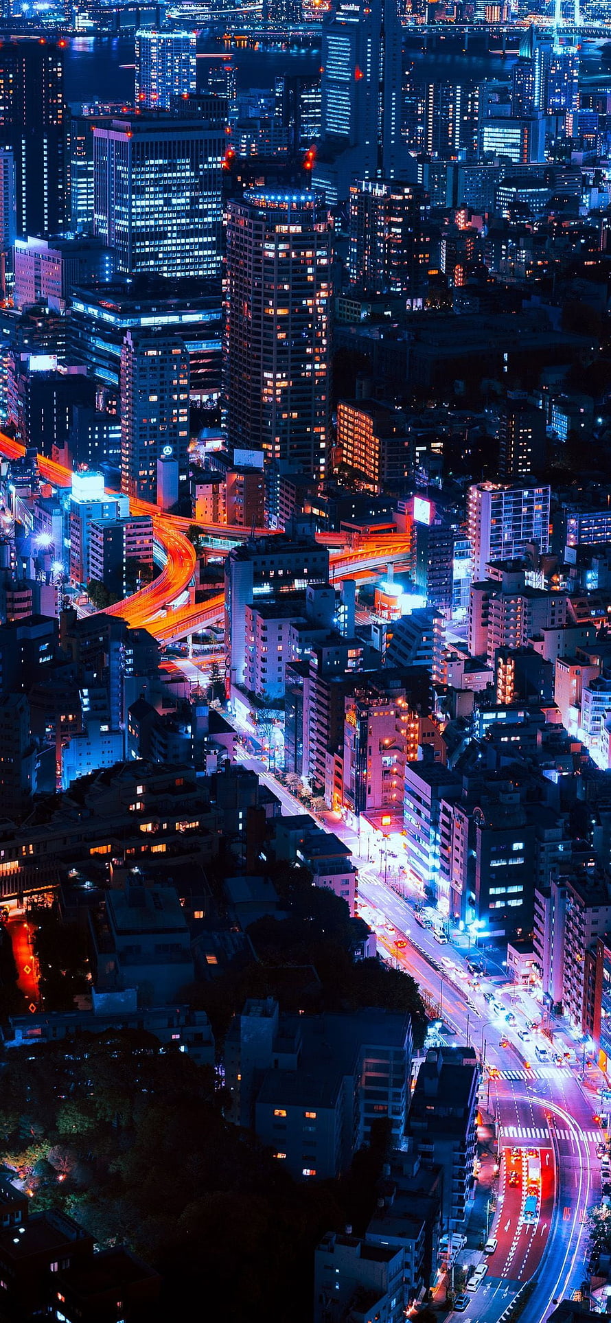 Aerial Night View of Tokyo Cityscape with Glowing Highway Light Trails and Neon Skyscrapers HD phone wallpaper