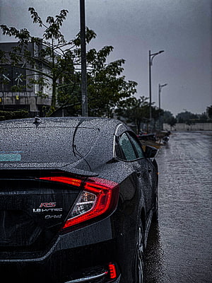 Rear View of a Wet Black Honda Civic RS Sedan Parked on a Rainy Street HD phone wallpaper