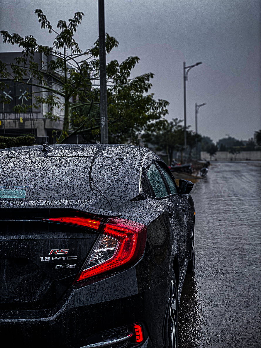 Rear View of a Wet Black Honda Civic RS Sedan Parked on a Rainy Street HD phone wallpaper