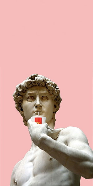 Michelangelo's David Statue Sipping a McDonald's Drink Against a Soft Pink Background HD phone wallpaper