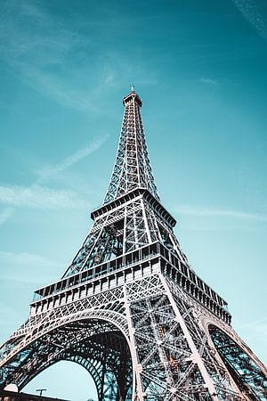 Eiffel Tower in Paris France: Iconic Iron Lattice Architecture Against a Clear Blue Sky HD phone wallpaper