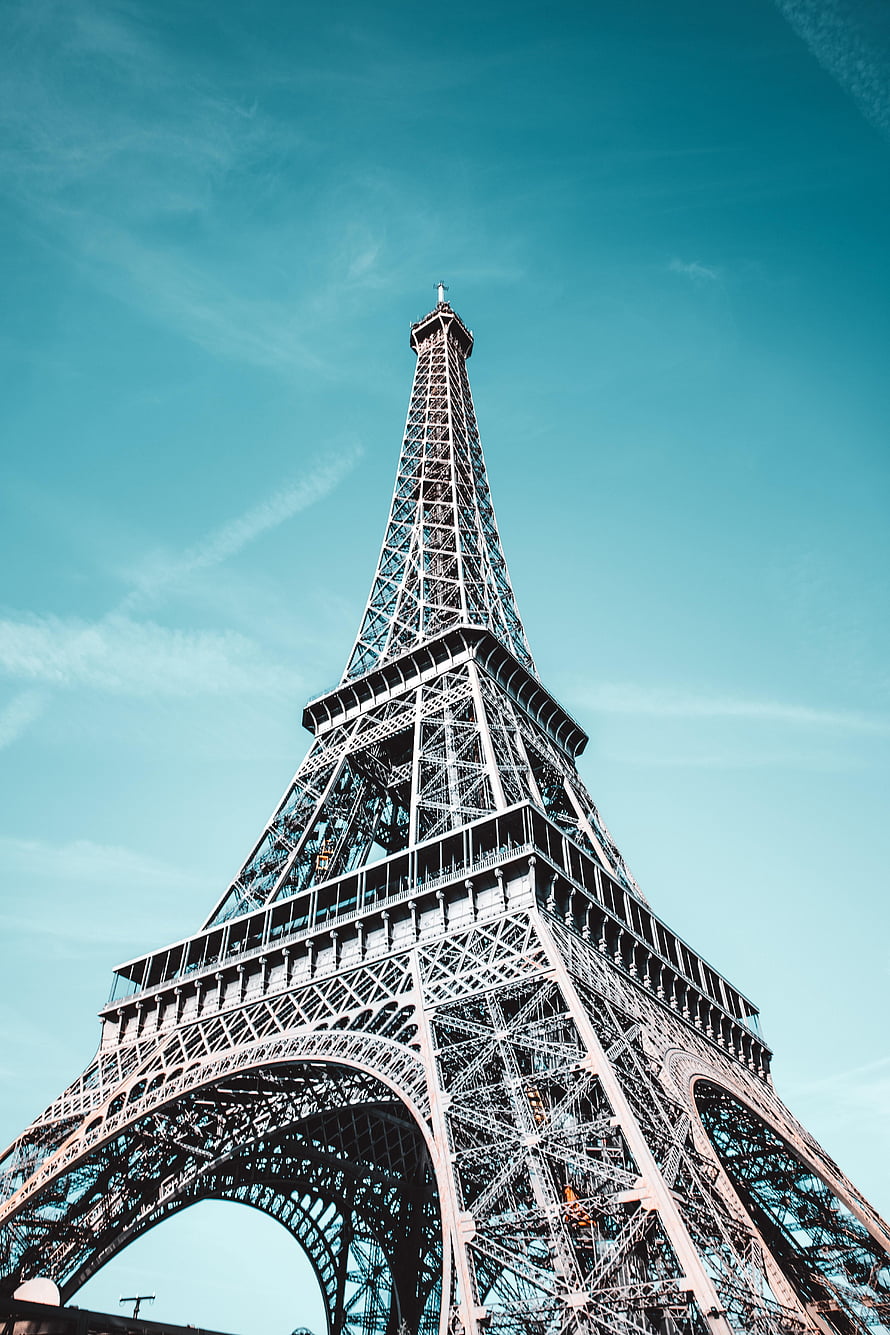 Eiffel Tower in Paris France: Iconic Iron Lattice Architecture Against a Clear Blue Sky HD phone wallpaper