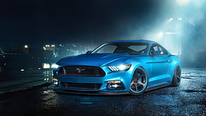 Blue Ford Mustang GT Night Scene on Wet Asphalt with City Lights HD wallpaper