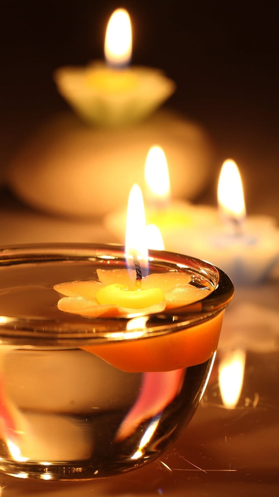 Floating Lotus Candles in Glass Bowl with Warm Ambient Glow HD phone wallpaper